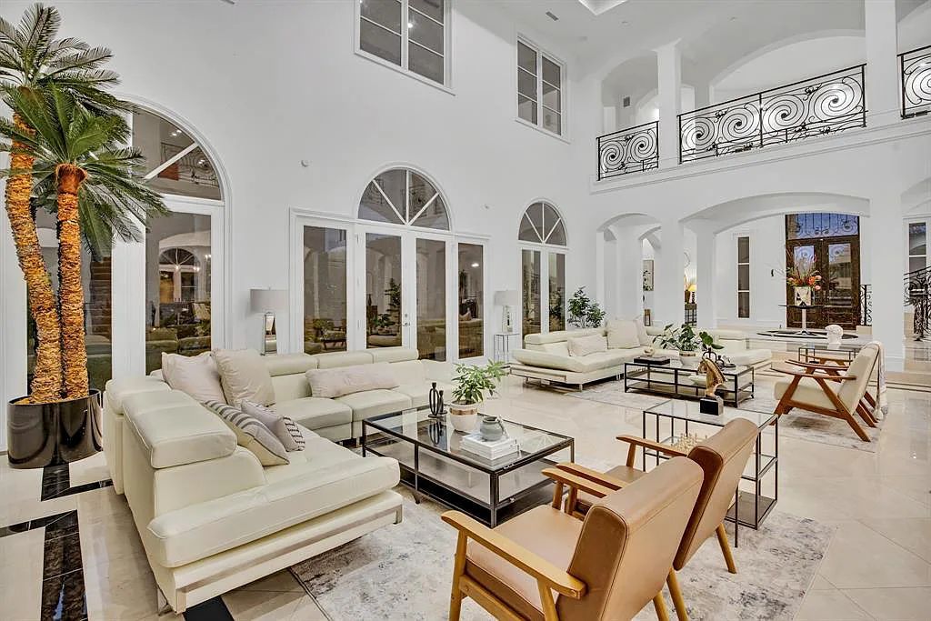 39 Braewood Pl, Dallas, Texas is a stunning estate in prestigious gated-guarded Glen Abbey multiple living areas on all floors, walls of windows, and a large beautiful covered backyard patio. 