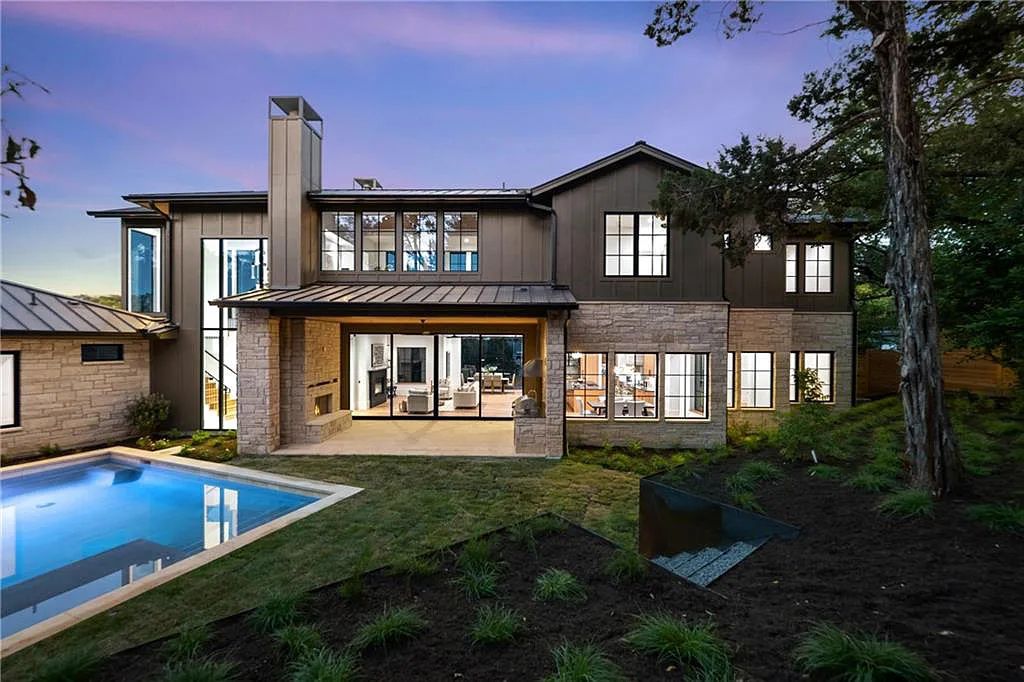 5102 Beverly Skyline, Austin, Texas is a newly constructed house with exceptional Hill Country views features an open kitchen, amazing living spaces, a game room, spa-like bathrooms, a heated pool, covered kitchen with stainless grill, sink and cooler area and more. This home in Austin offers 5 bedrooms and 7 bathrooms with nearly 5,000 square feet of living spaces.