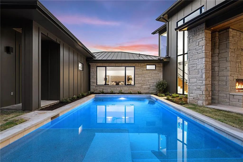 5102 Beverly Skyline, Austin, Texas is a newly constructed house with exceptional Hill Country views features an open kitchen, amazing living spaces, a game room, spa-like bathrooms, a heated pool, covered kitchen with stainless grill, sink and cooler area and more. This home in Austin offers 5 bedrooms and 7 bathrooms with nearly 5,000 square feet of living spaces.