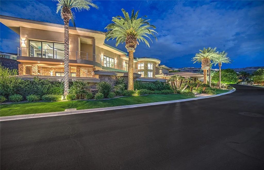 The Home in Henderson, an entirely custom & contemporary home offers views from every room, private courtyard with pool, spa, outdoor kitchen, fire pit and built-in BBQ, dual living rooms with fireplaces, motorized shades is now available for sale. This home located at 580 Saint Croix St, Henderson, Nevada