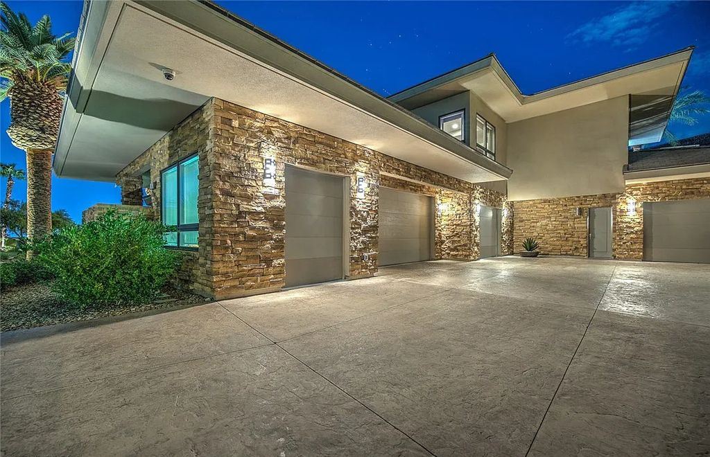 The Home in Henderson, an entirely custom & contemporary home offers views from every room, private courtyard with pool, spa, outdoor kitchen, fire pit and built-in BBQ, dual living rooms with fireplaces, motorized shades is now available for sale. This home located at 580 Saint Croix St, Henderson, Nevada