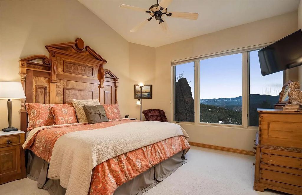 25580 Sunset Lane, Evergreen, Colorado is an uniquely designed home situated in a beautiful, natural setting of rock outcroppings with spectacular views of Evergreen and the snow capped mountains.