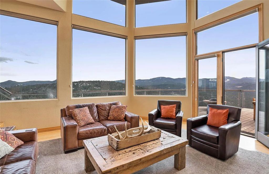 25580 Sunset Lane, Evergreen, Colorado is an uniquely designed home situated in a beautiful, natural setting of rock outcroppings with spectacular views of Evergreen and the snow capped mountains.