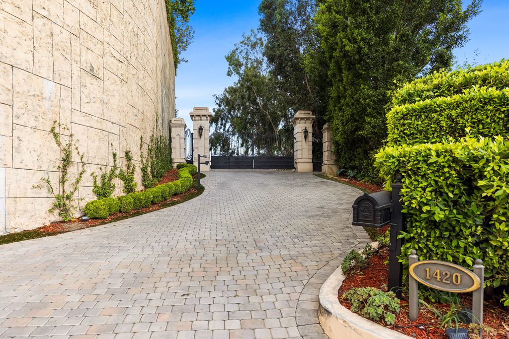 The Estate in Beverly Hills, a fortress of unparalleled magnitude poised high atop a promontory overlooking the stunning gardens and city, quintessential to the highest class of luxury living and beauty in the highest regard is now available for sale. This home located at 1420 Davies Dr, Beverly Hills, California