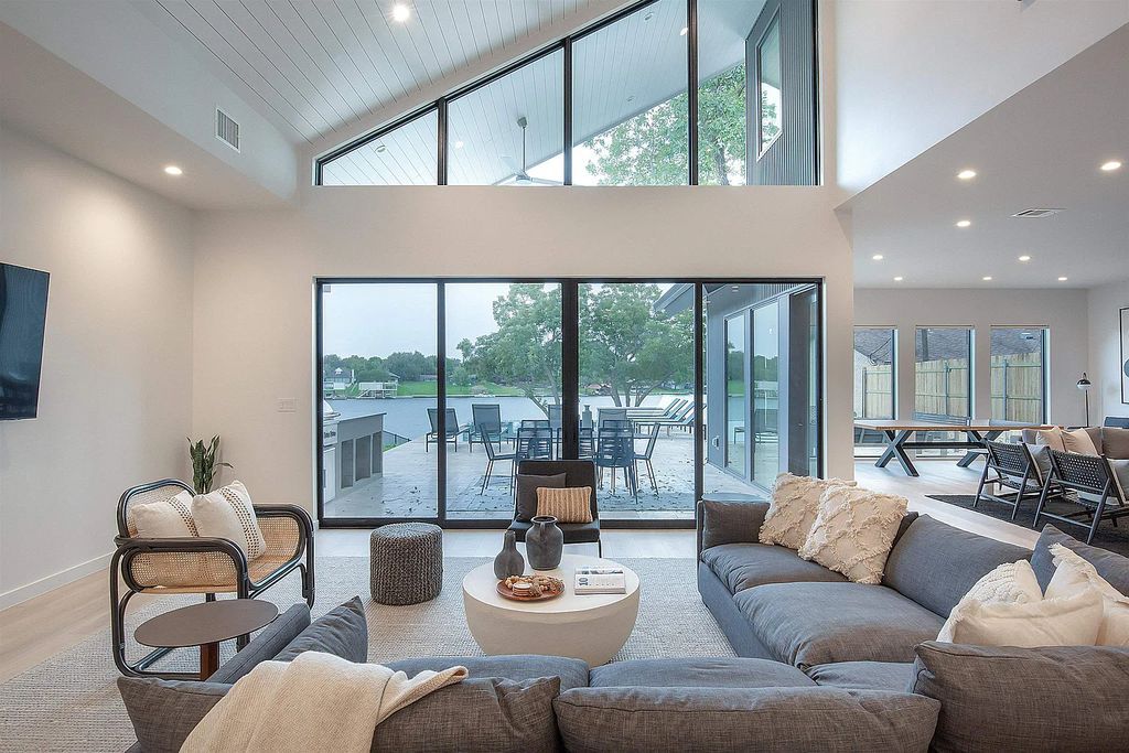 The Home in Kingsland, a Brand-New Contemporary lakefront estate with a private backyard oasis including a resort style infinity pool, hot tub, covered cabana and outdoor kitchen is now available for sale. This home located at 1836 Bluebonnet, Kingsland, Texas