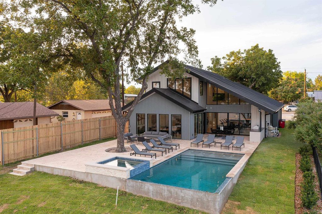 The Home in Kingsland, a Brand-New Contemporary lakefront estate with a private backyard oasis including a resort style infinity pool, hot tub, covered cabana and outdoor kitchen is now available for sale. This home located at 1836 Bluebonnet, Kingsland, Texas