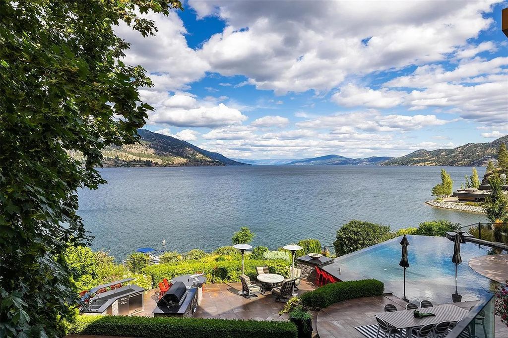 The Residence in Kelowna has been carefully crafted into the lakeside landscape with precision, now available for sale. This home located at 208 Poplar Point Dr, Kelowna, BC V1Y 1Y1, Canada
