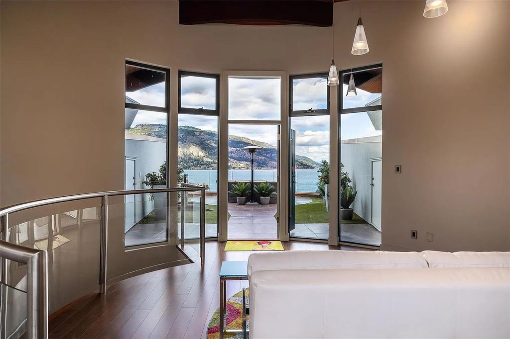 The Residence in Kelowna has been carefully crafted into the lakeside landscape with precision, now available for sale. This home located at 208 Poplar Point Dr, Kelowna, BC V1Y 1Y1, Canada