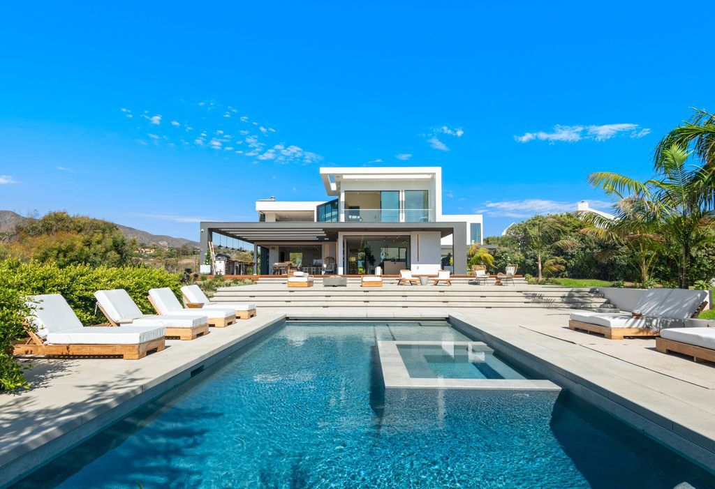 The Home in Malibu, a brand new architectural estate with breathtaking ocean and mountain views from every room and seamless flow from expansive interiors to resort-style decks and patios is now available for sale. This home located at 30227 Pacific Coast Hwy, Malibu, California