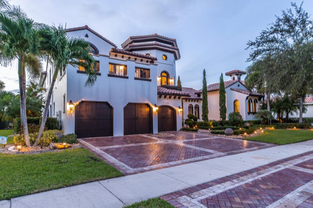 The Home in Parkland, a magnificent mini mansion with a beautiful backyard overlooking rolling fairways, tranquil water and stunning pool area is now available for sale. This home located at 7235 Lemon Grass Dr, Parkland, Florida