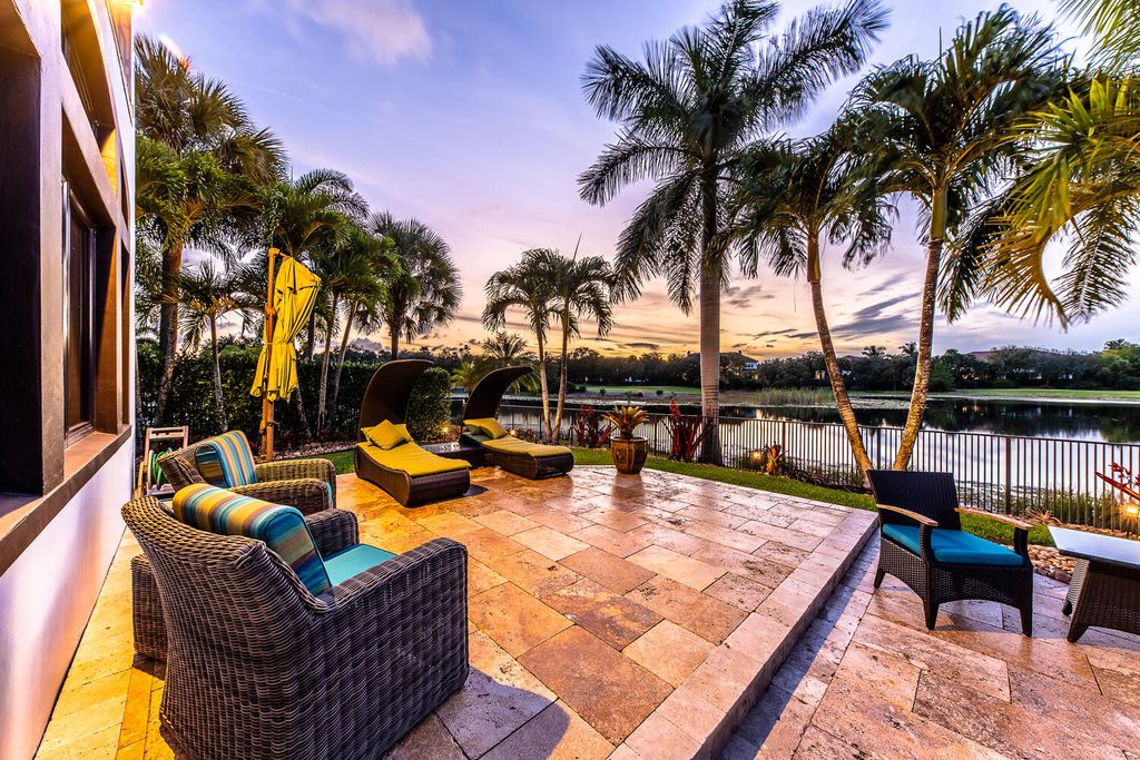 The Home in Parkland, a magnificent mini mansion with a beautiful backyard overlooking rolling fairways, tranquil water and stunning pool area is now available for sale. This home located at 7235 Lemon Grass Dr, Parkland, Florida