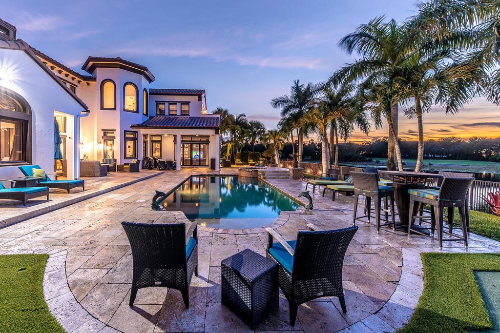 The Home in Parkland, a magnificent mini mansion with a beautiful backyard overlooking rolling fairways, tranquil water and stunning pool area is now available for sale. This home located at 7235 Lemon Grass Dr, Parkland, Florida