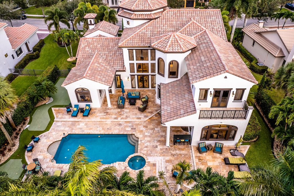 The Home in Parkland, a magnificent mini mansion with a beautiful backyard overlooking rolling fairways, tranquil water and stunning pool area is now available for sale. This home located at 7235 Lemon Grass Dr, Parkland, Florida