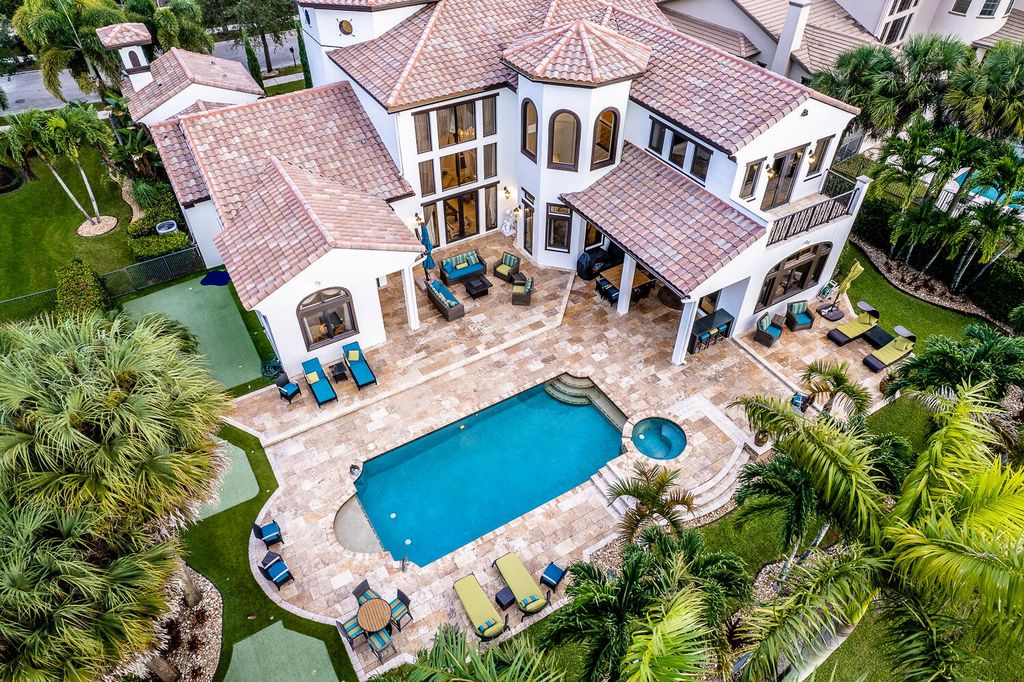 The Home in Parkland, a magnificent mini mansion with a beautiful backyard overlooking rolling fairways, tranquil water and stunning pool area is now available for sale. This home located at 7235 Lemon Grass Dr, Parkland, Florida