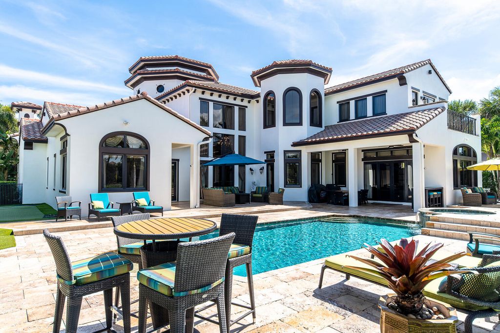 The Home in Parkland, a magnificent mini mansion with a beautiful backyard overlooking rolling fairways, tranquil water and stunning pool area is now available for sale. This home located at 7235 Lemon Grass Dr, Parkland, Florida