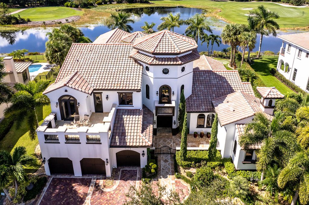 The Home in Parkland, a magnificent mini mansion with a beautiful backyard overlooking rolling fairways, tranquil water and stunning pool area is now available for sale. This home located at 7235 Lemon Grass Dr, Parkland, Florida