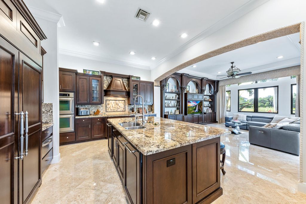 The Home in Parkland, a magnificent mini mansion with a beautiful backyard overlooking rolling fairways, tranquil water and stunning pool area is now available for sale. This home located at 7235 Lemon Grass Dr, Parkland, Florida