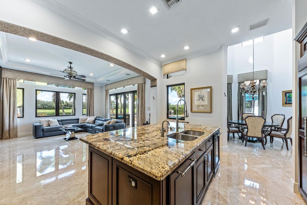 The Home in Parkland, a magnificent mini mansion with a beautiful backyard overlooking rolling fairways, tranquil water and stunning pool area is now available for sale. This home located at 7235 Lemon Grass Dr, Parkland, Florida