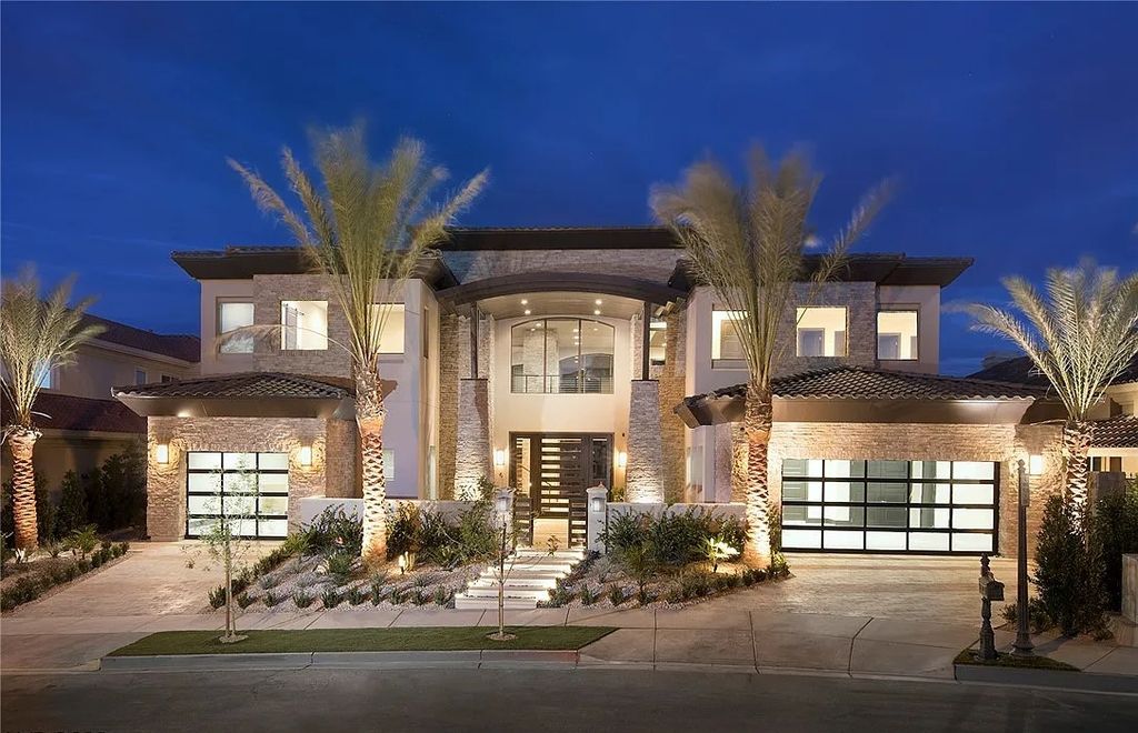 The Villa in Henderson, a custom modern contemporary architecture by Richard Luke offers elegant walk-on-water entrance, movie theater, glass wine cellar, game room, office, elevator, pocket doors, linear fireplaces, and more is now available for sale. This home located at 2656 Mirabella St, Henderson, Nevada