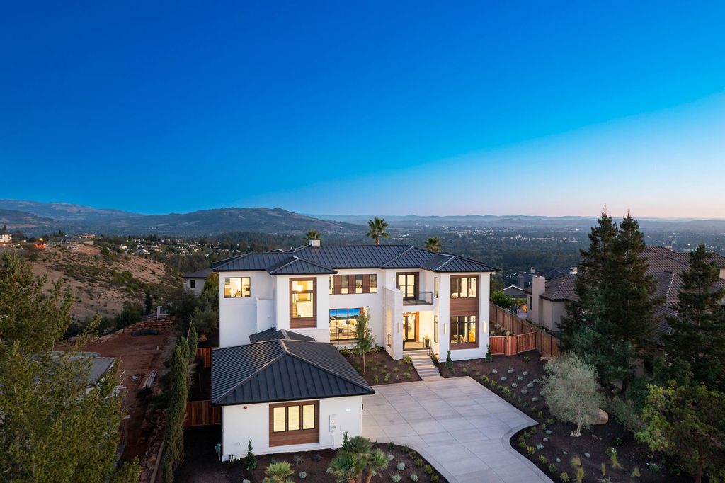 2240 Newgate Ct, Santa Rosa, California is an newly built exceptional house offers sweeping city light views over the resort style rear yard and the mountains beyond.