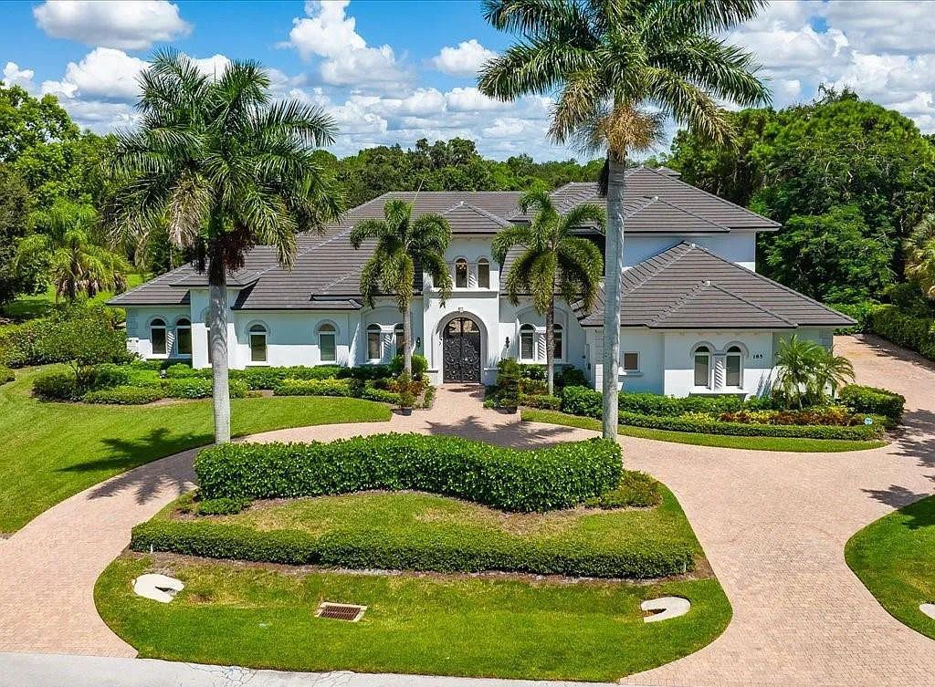 185 Tupelo Rd, Naples, Florida is an exceptional estate home situated on a spectacular lot in the high sought-after community of Pine Ridge with thoughtfully designed dramatic and spacious architecture.