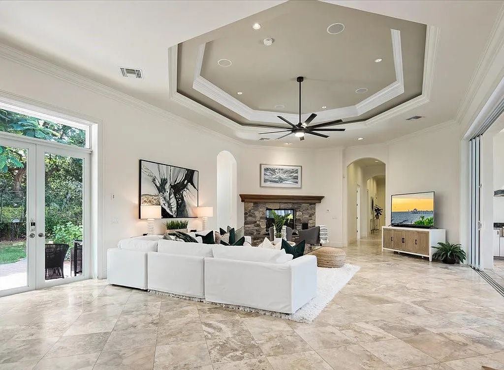 185 Tupelo Rd, Naples, Florida is an exceptional estate home situated on a spectacular lot in the high sought-after community of Pine Ridge with thoughtfully designed dramatic and spacious architecture.