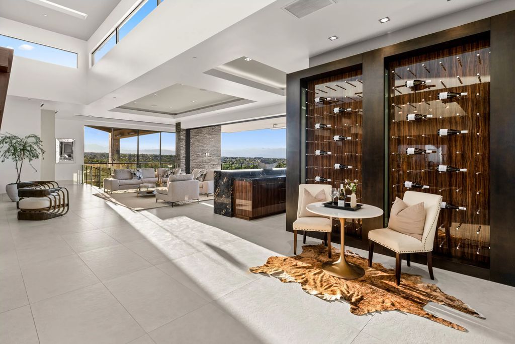 The Home in Henderson, a hilltop sanctuary tucked within luxuriant privacy with sweeping views of mountains, the city, and the strip exudes undeniable ease and grace is now available for sale. This estate located at 509 Dragon Gate Ct, Henderson, Nevada