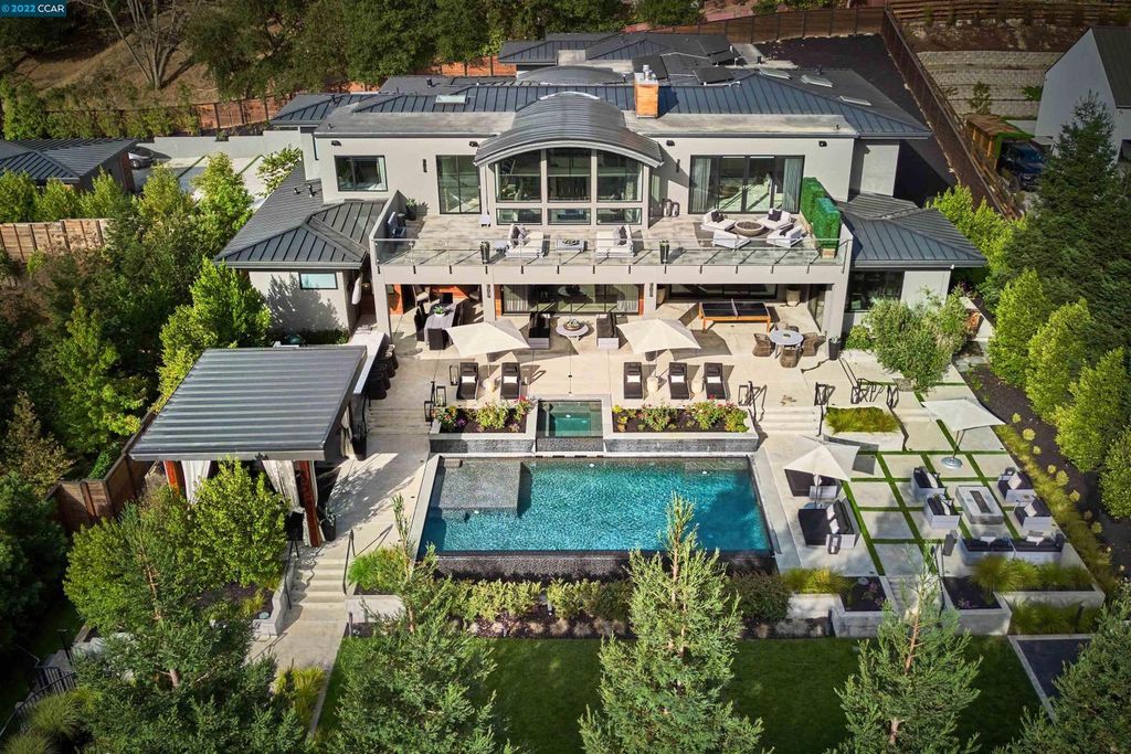 1060 Livorna Road, Alamo, California is a spectacular showplace with luxurious amenities includes 30-foot ceilings, floor-to-ceiling glass, double-sided fireplace, custom lighting, heated Italian wood floors and dual island chef’s kitchen, glass and steel floating staircase and more.