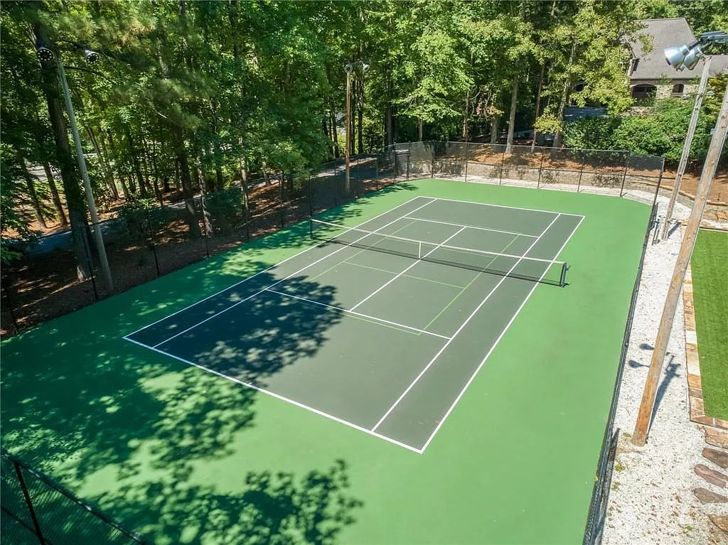 The Estate in Marietta is a luxurious home featuring a spacious formal living room and a private tennis court now available for sale. This home located at 1638 Little Willeo Rd, Marietta, Georgia; offering 05 bedrooms and 09 bathrooms with 9,558 square feet of living spaces.