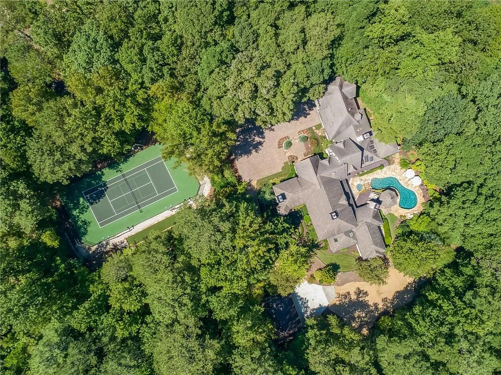 The Estate in Marietta is a luxurious home featuring a spacious formal living room and a private tennis court now available for sale. This home located at 1638 Little Willeo Rd, Marietta, Georgia; offering 05 bedrooms and 09 bathrooms with 9,558 square feet of living spaces.