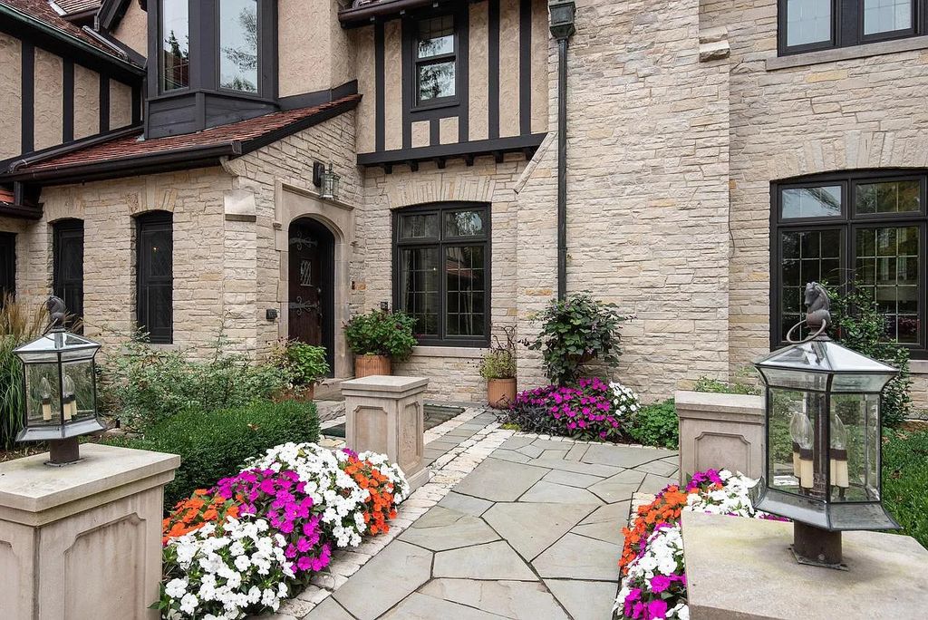 The Mansion in Shorewood offers beautiful backyard with outdoor granite Kit, pergola dining area and Firepit, now available for sale. This home located at 4496 North Lake Dr, Shorewood, Wisconsin