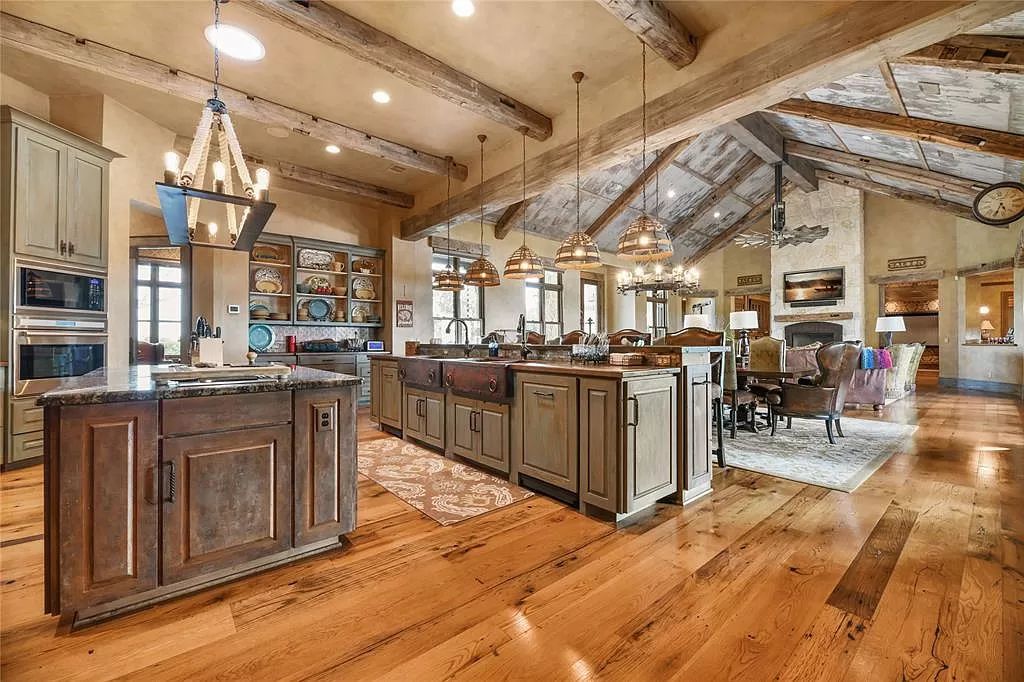6957 Fm 1361, Somerville, Texas is a Breathtakingly Beautiful Ranch with exquisite detail and thoughtfully planned design featuring a grand open family gathering space and a movie media, game table, open bar and a player piano.