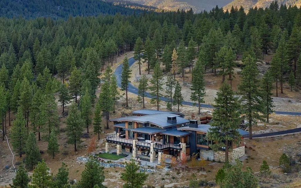 273 Swifts Station Drive, Carson City, Nevada is a magnificent estate set on a spectacular homesite behind private gates in Clear Creek Tahoe boasting an open-concept, free-flowing form throughout, complete with walls of glass offering stunning views in all directions.