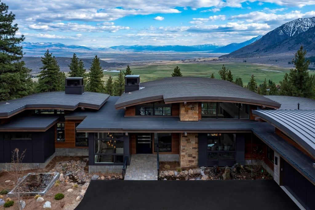 273 Swifts Station Drive, Carson City, Nevada is a magnificent estate set on a spectacular homesite behind private gates in Clear Creek Tahoe boasting an open-concept, free-flowing form throughout, complete with walls of glass offering stunning views in all directions.