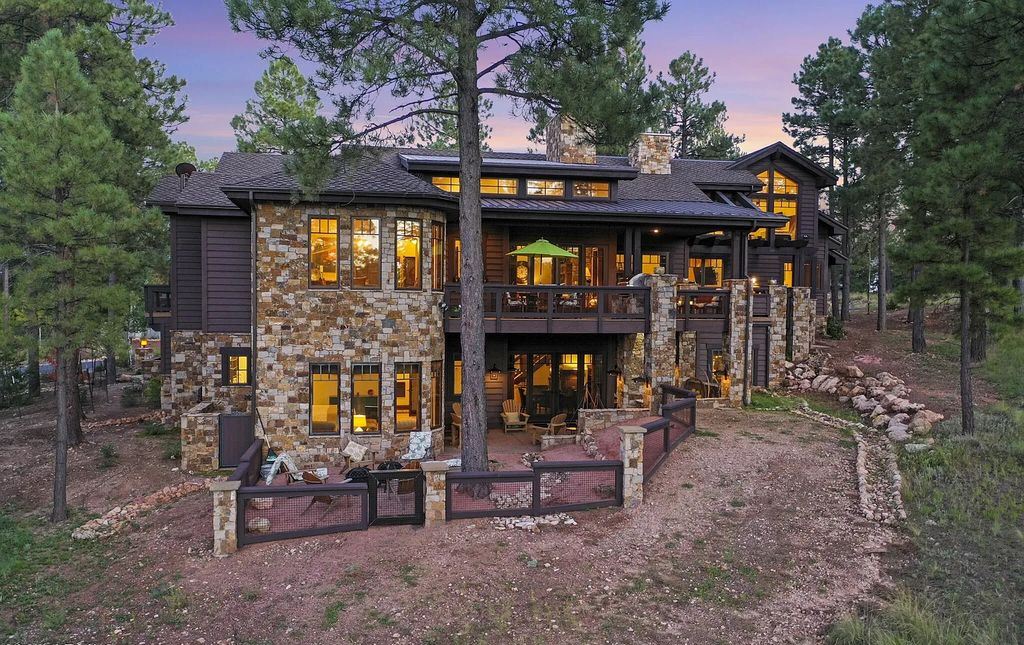The Home in Flagstaff, a stunning estate features natural Telluride stone, a tranquil fountain at the front entry and a monumental stone fireplace as the centerpiece of the great room is now available for sale. This home located at 3900 Clubhouse Cir, Flagstaff, Arizona