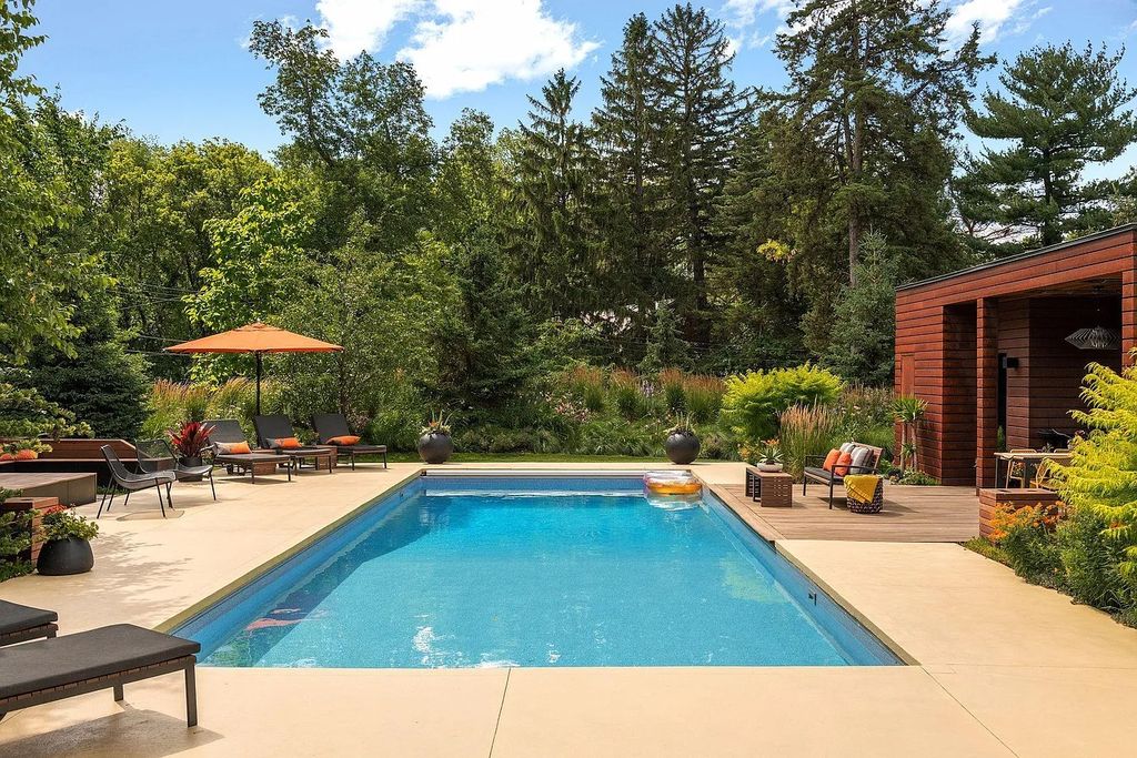 The House in Golden Valley offers outdoor kitchen with all the accoutrements for entertaining, cozy sauna and poolside bath with shower, now available for sale. This home located at 3902 Glenwood Ave, Golden Valley, Minnesota