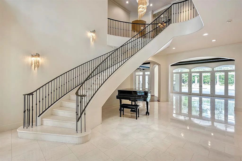 5506 Russett Dr, Houston, Texas is a one of a kind home on a private cul-de-sac with exquisite finishes and features including reclaimed hardwoods & limestone floors, cast-stone adorning all 5 fireplaces, elevator to 3rd floor, and more.