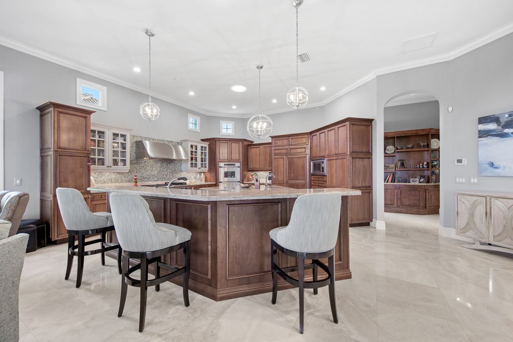 208 Audubon Boulevard, Naples, Florida is a beautiful estate designed for living life to the fullest and capable of accommodating a large family or multiple guests in total comfort.