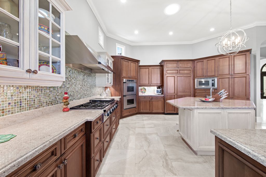 208 Audubon Boulevard, Naples, Florida is a beautiful estate designed for living life to the fullest and capable of accommodating a large family or multiple guests in total comfort.