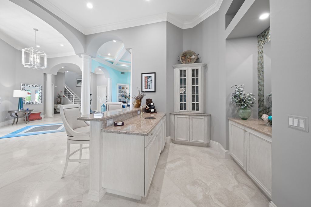 208 Audubon Boulevard, Naples, Florida is a beautiful estate designed for living life to the fullest and capable of accommodating a large family or multiple guests in total comfort.