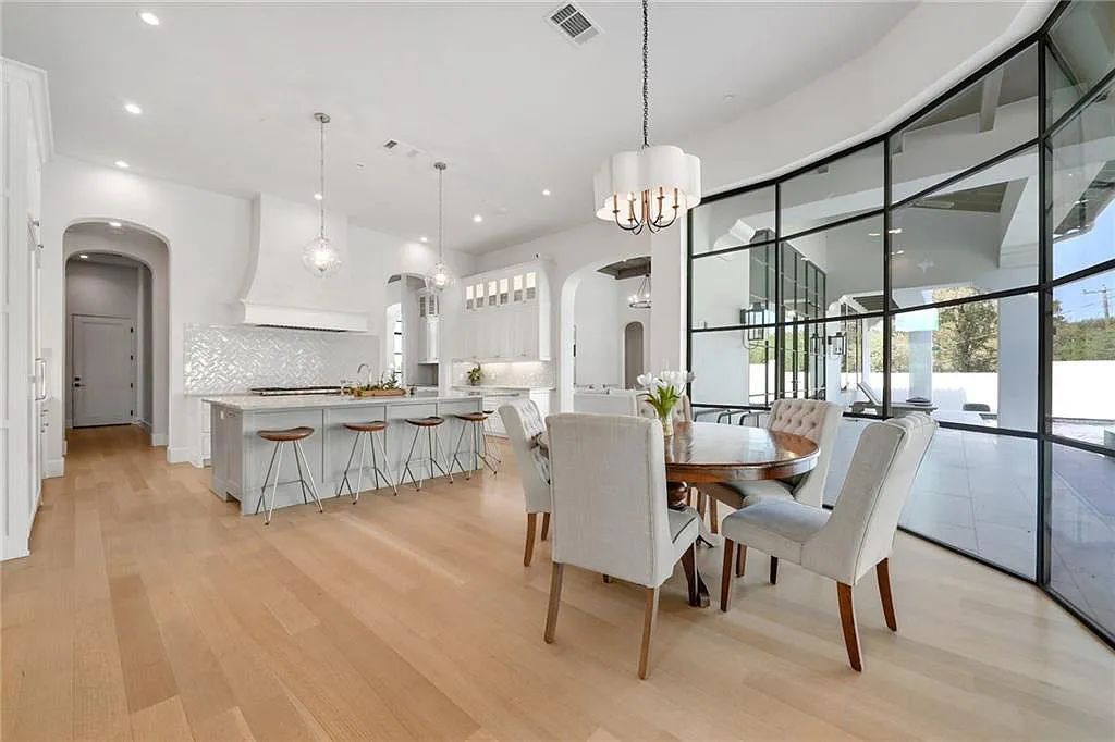 The Home in Austin, an immaculate modern estate nestled in the peaceful and tree-filled neighborhood of Rollingwood features resort-style backyard with a pool and spa, a covered outdoor kitchen is now available for sale. This home located at 4713 Timberline Dr, Austin, Texas