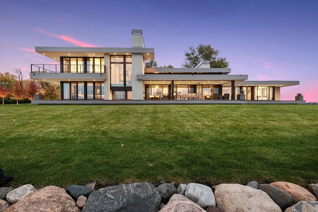 The Residence in Tonka Bay offers expansive 180-degree views of Lake Minnetonka with 233' of frontage, now available for sale. This home located at 275 Lakeview Ave, Tonka Bay, Minnesota