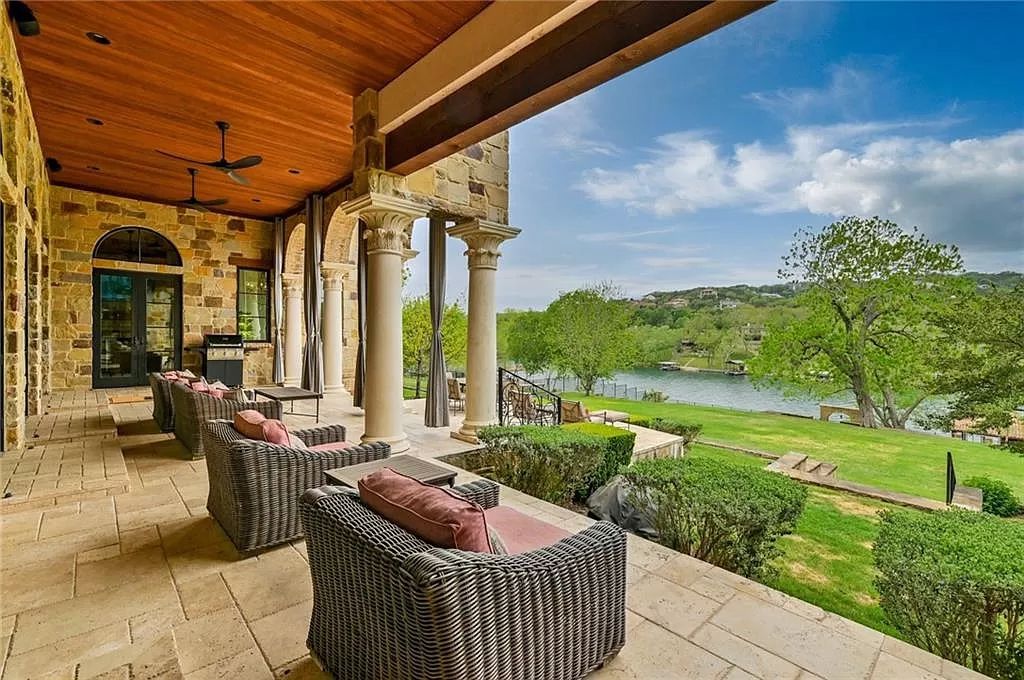 14624 Flat Top Ranch Road, Austin, Texas is a waterfront estate was updated throughout in 2020 boasting custom finishes, a double-height living room, an idyllic outdoor area, Control 4 System for music, lighting, and heat.