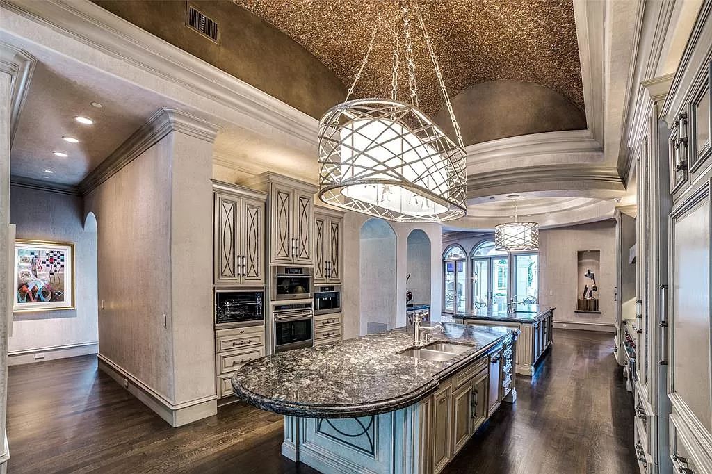 5969 Westgrove Circle, Dallas, Texas is a masterpiece captivates at every turn with three gorgeous fountains spread throughout the lush, mature trees, multiple covered patios, cabana and pool.