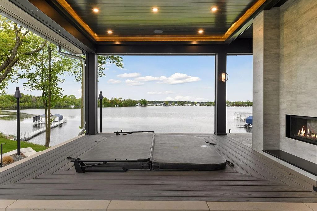 The House in Wayzata supplies a perfect blend of indoor & outdoor living amenities geared towards a year-round experience, now available for sale. This home located at 980 Heritage Ln, Wayzata, Minnesota