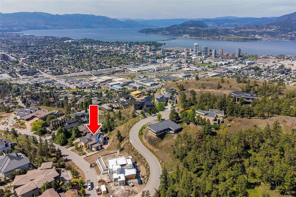 The House in Kelowna is an architectural dream house in the most exclusive private gated community, now available for sale. This home located at 732 Highpointe Pl, Kelowna, BC V1V 2Y3, Canada