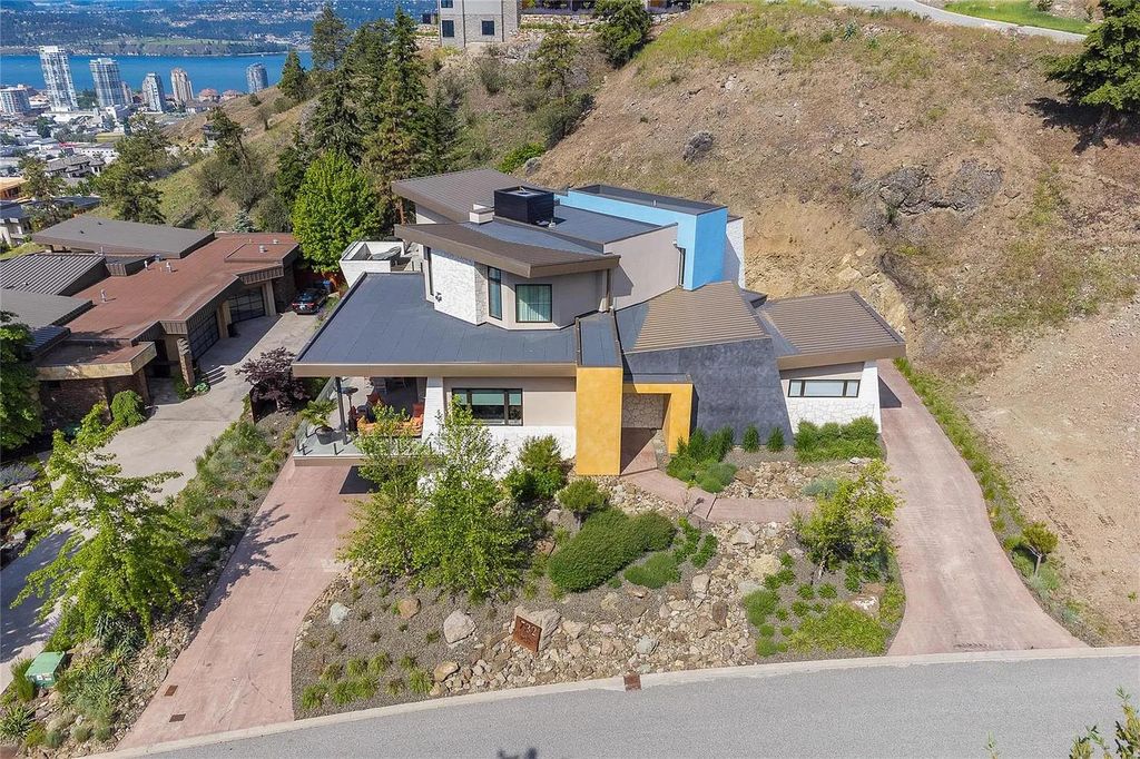 The House in Kelowna is an architectural dream house in the most exclusive private gated community, now available for sale. This home located at 732 Highpointe Pl, Kelowna, BC V1V 2Y3, Canada