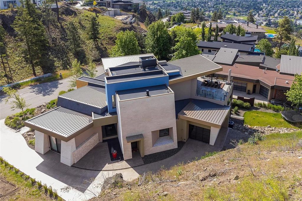 The House in Kelowna is an architectural dream house in the most exclusive private gated community, now available for sale. This home located at 732 Highpointe Pl, Kelowna, BC V1V 2Y3, Canada