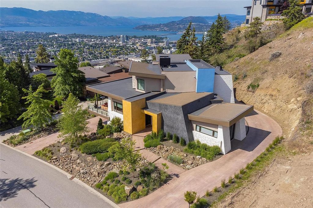 The House in Kelowna is an architectural dream house in the most exclusive private gated community, now available for sale. This home located at 732 Highpointe Pl, Kelowna, BC V1V 2Y3, Canada