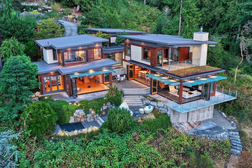 The Estate in Gibsons is a luxurious home offering exceptional privacy with a gorgeous mature landscaping and ocean views now available for sale. This home located at 1012 Marine Dr, Gibsons, BC V0N 1V1, Canada; offering 03 bedrooms and 04 bathrooms with 3,944 square feet of living spaces.